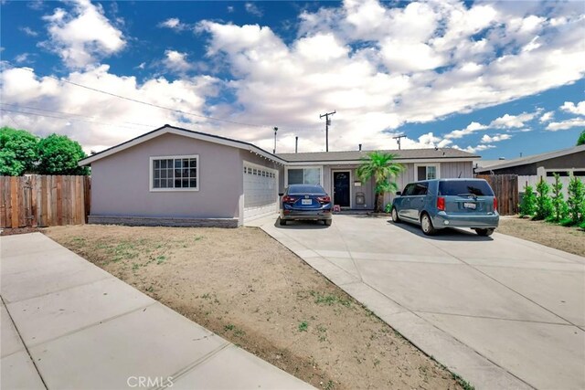 ranch-style home featuring a garage