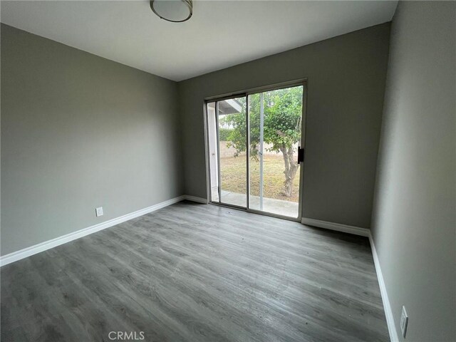 empty room featuring wood-type flooring