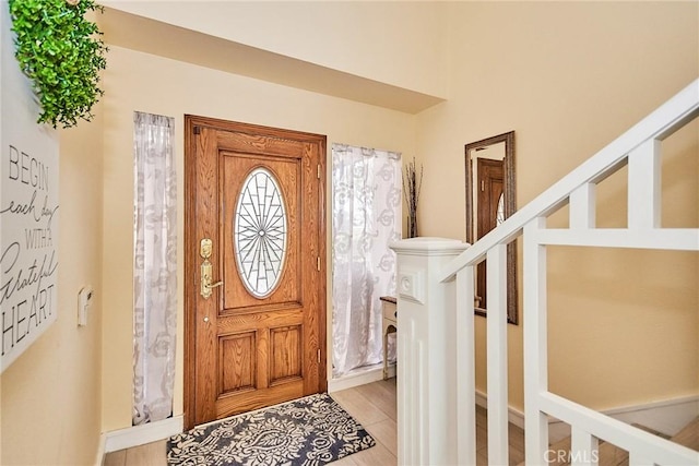 foyer entrance with light hardwood / wood-style flooring