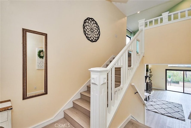 stairway with hardwood / wood-style flooring