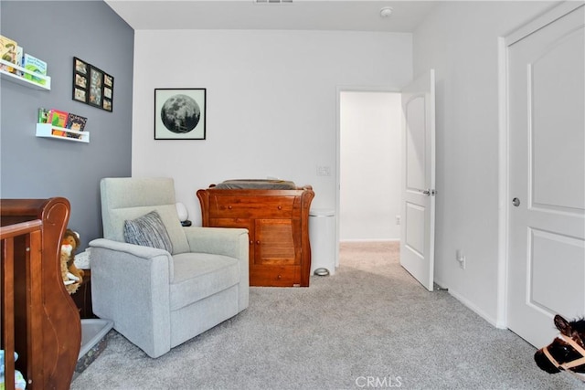 living area featuring light colored carpet