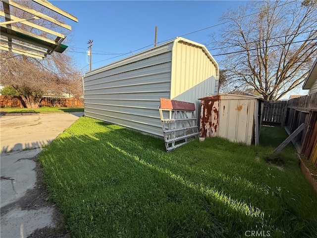 view of outbuilding with a yard