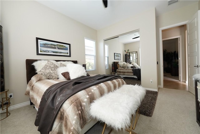 carpeted bedroom featuring a closet