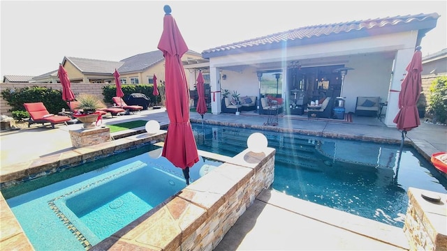 view of pool featuring a hot tub and a patio