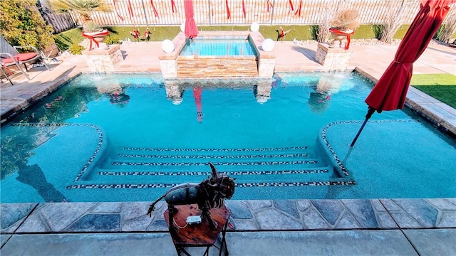 view of pool featuring a jacuzzi and pool water feature