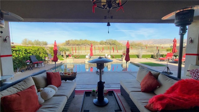 view of patio / terrace featuring a fenced in pool and outdoor lounge area