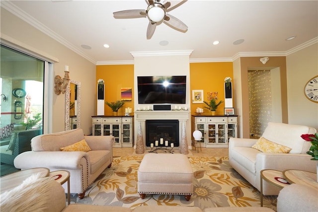 living room with ceiling fan and ornamental molding