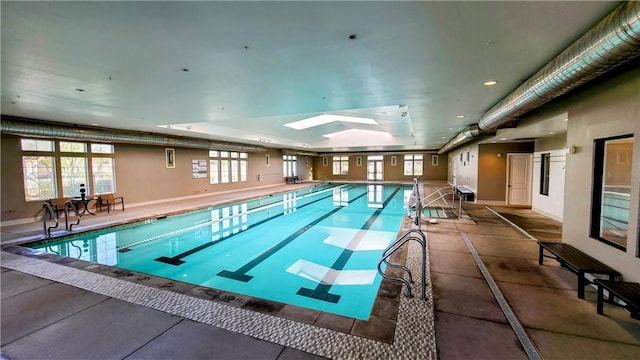 view of pool featuring a skylight