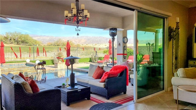 view of patio featuring a mountain view and a fenced in pool