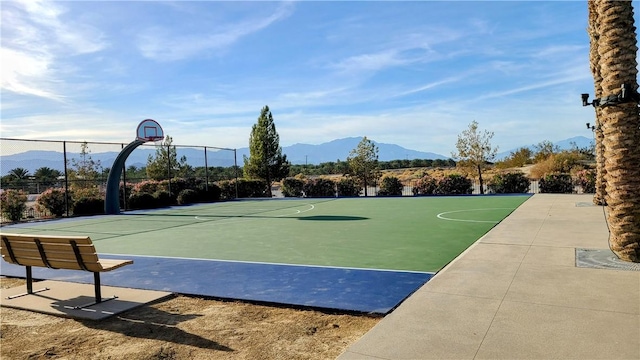 view of basketball court featuring a mountain view