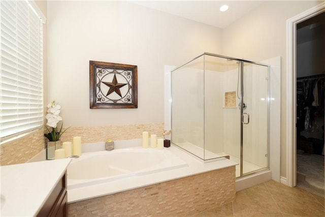 bathroom with plus walk in shower, tile patterned floors, and vanity