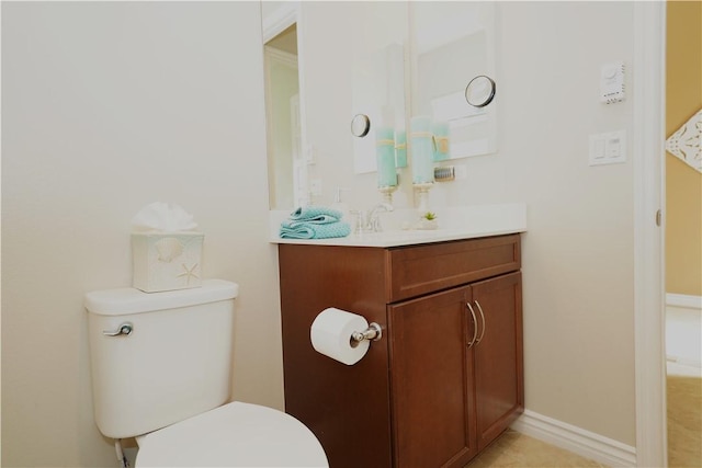 bathroom with toilet and vanity