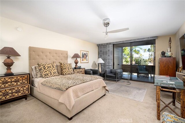 bedroom with ceiling fan, access to exterior, floor to ceiling windows, and carpet flooring