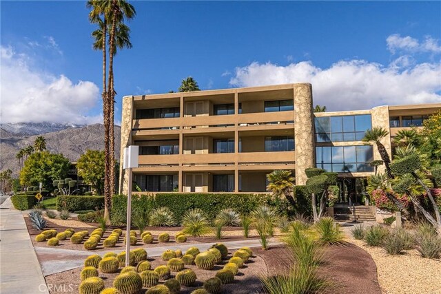 view of building exterior featuring a mountain view