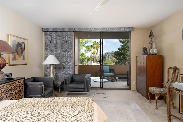 bedroom featuring access to exterior and light colored carpet