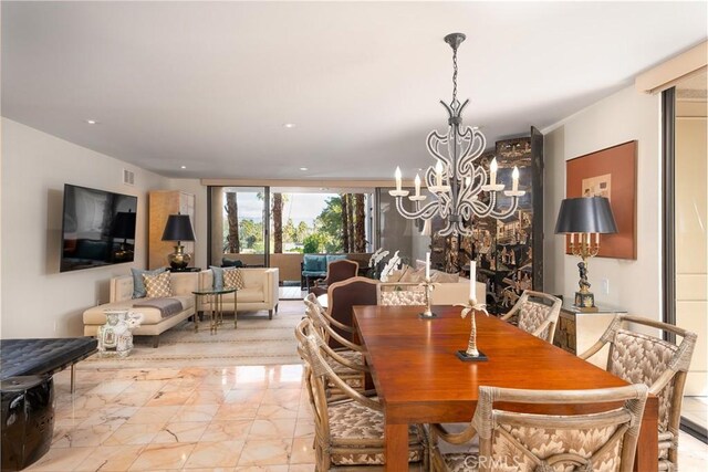 dining space with a chandelier