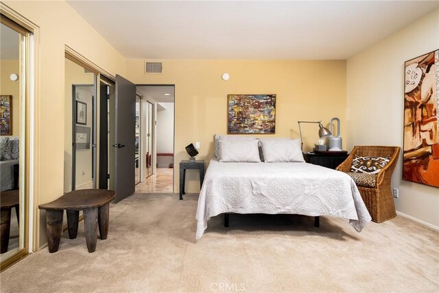 bedroom featuring light colored carpet