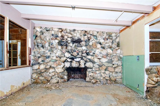 room details with beam ceiling and a fireplace