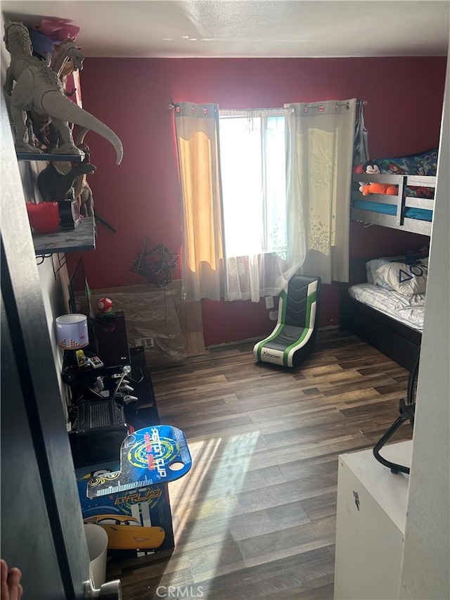 bedroom featuring wood-type flooring