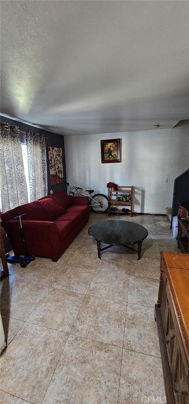 living room featuring a textured ceiling