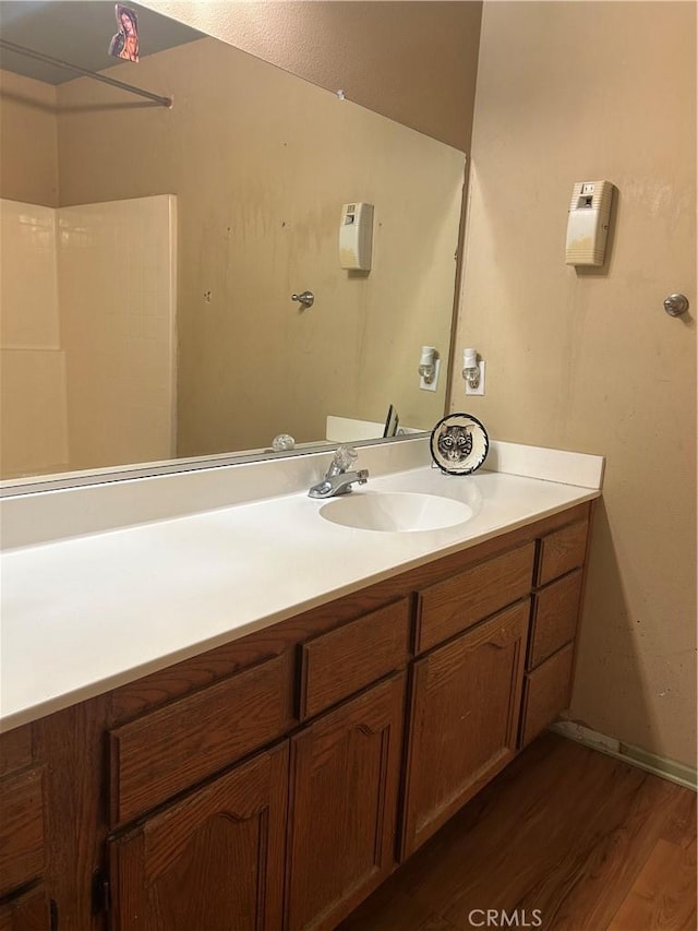 bathroom featuring wood-type flooring and vanity