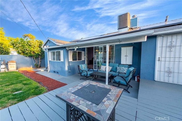 wooden deck featuring an outdoor living space