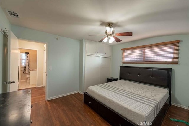 bedroom featuring dark wood-type flooring, a closet, and ceiling fan