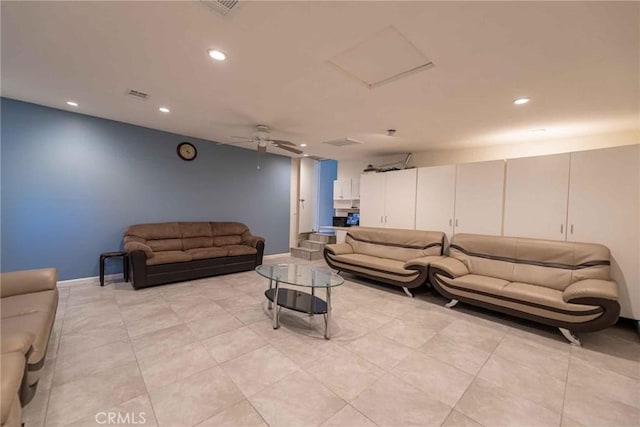 tiled living room with ceiling fan