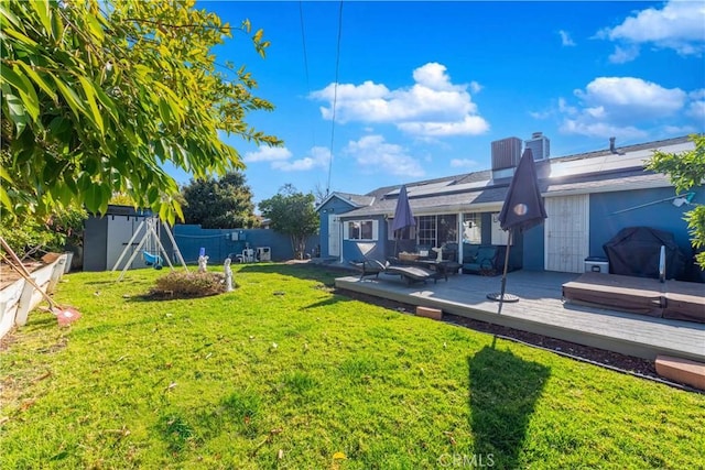 view of yard with a shed, a jacuzzi, an outdoor hangout area, and a wooden deck