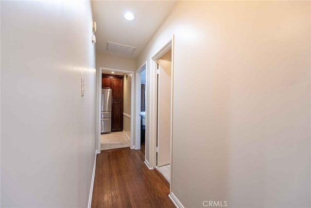 hallway featuring dark hardwood / wood-style flooring