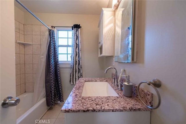 bathroom featuring tile patterned flooring, vanity, and shower / bath combo with shower curtain