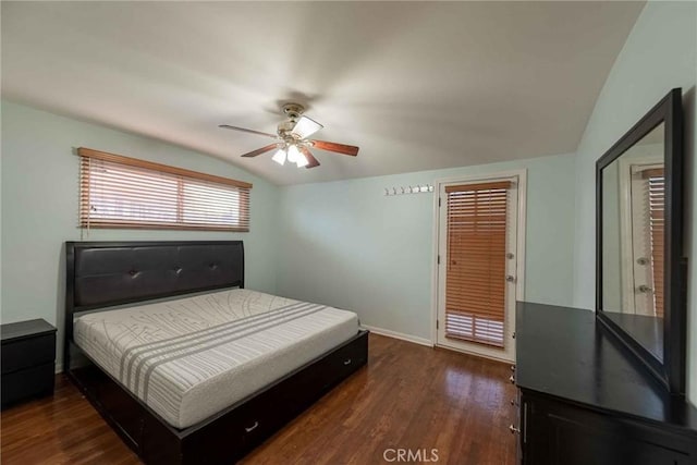 bedroom featuring vaulted ceiling, ceiling fan, and dark hardwood / wood-style flooring