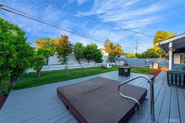 deck featuring a lawn