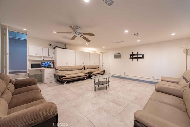 living room featuring ceiling fan, light tile patterned floors, and a wall mounted AC