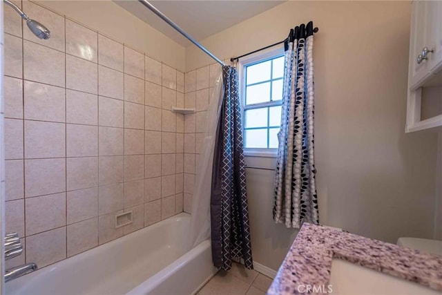 bathroom featuring tile patterned floors, vanity, and shower / tub combo