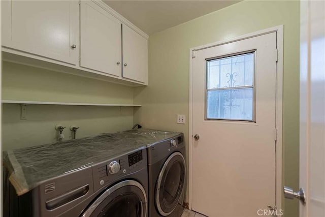 laundry area featuring cabinets and washing machine and clothes dryer