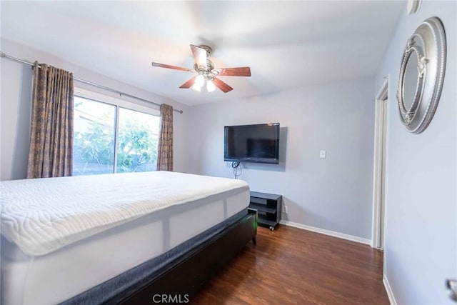 bedroom featuring dark wood-type flooring and ceiling fan