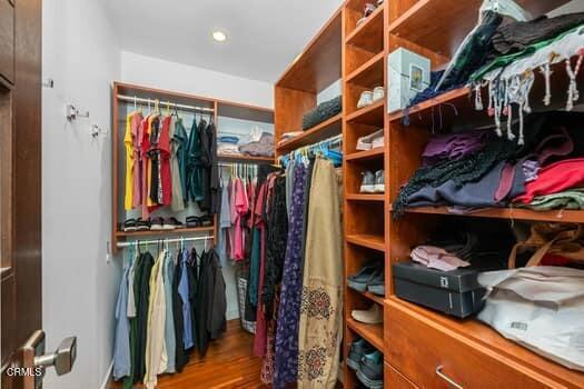 spacious closet with hardwood / wood-style floors