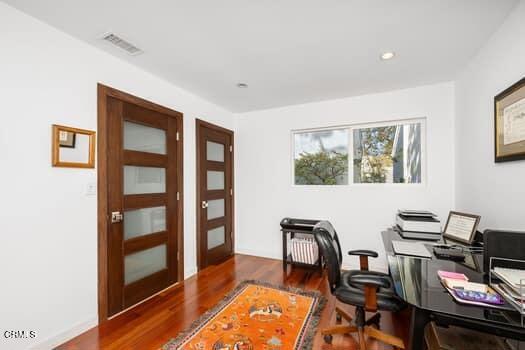 office space with french doors and dark hardwood / wood-style floors