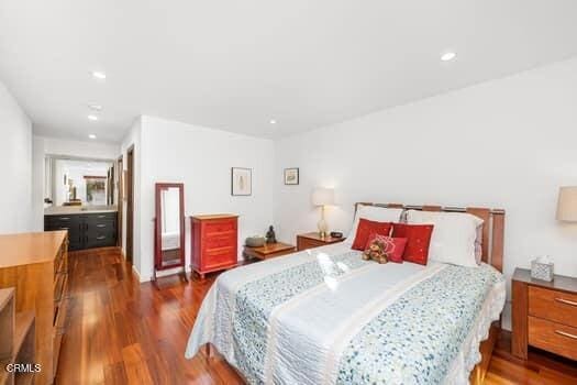 bedroom featuring dark wood-type flooring