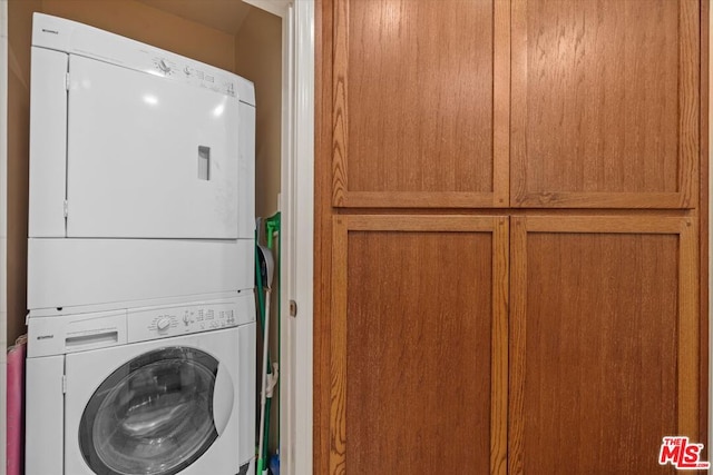 laundry room featuring stacked washing maching and dryer