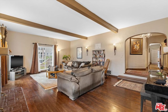 living room with beam ceiling, dark hardwood / wood-style flooring, and an inviting chandelier