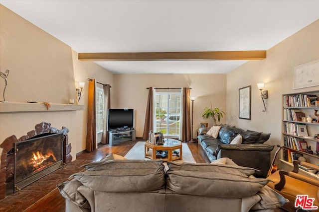 living room featuring beamed ceiling and wood-type flooring