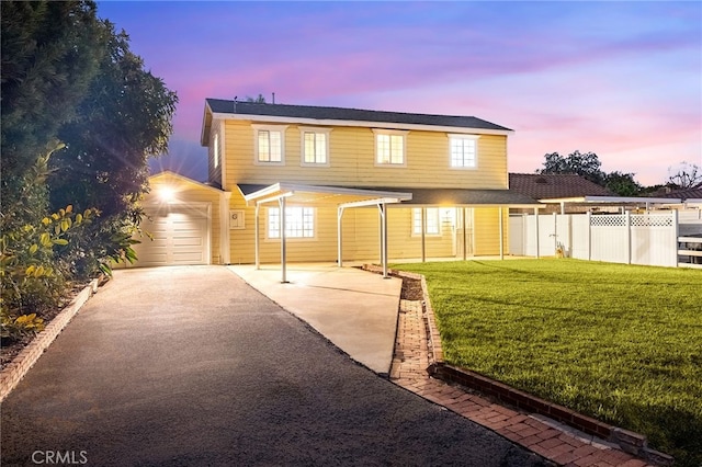 view of front property featuring a garage and a lawn