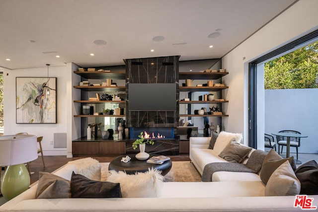 living room featuring hardwood / wood-style floors and a fireplace