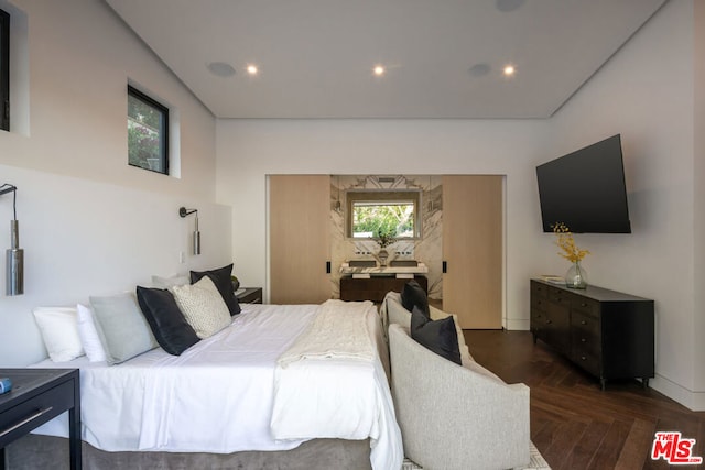 bedroom featuring dark parquet floors