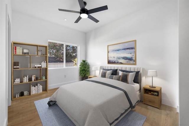 bedroom featuring ceiling fan and light hardwood / wood-style flooring