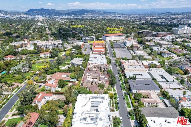 birds eye view of property featuring a mountain view