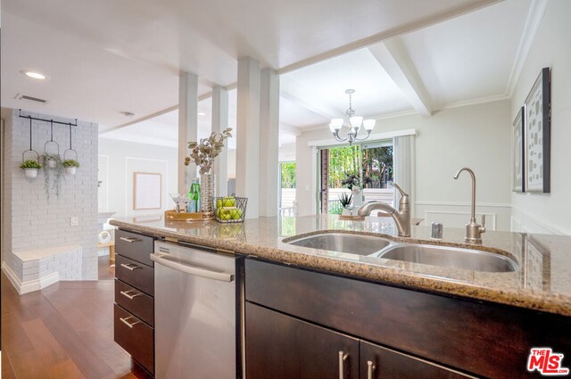 kitchen with an inviting chandelier, sink, dishwasher, and light stone countertops