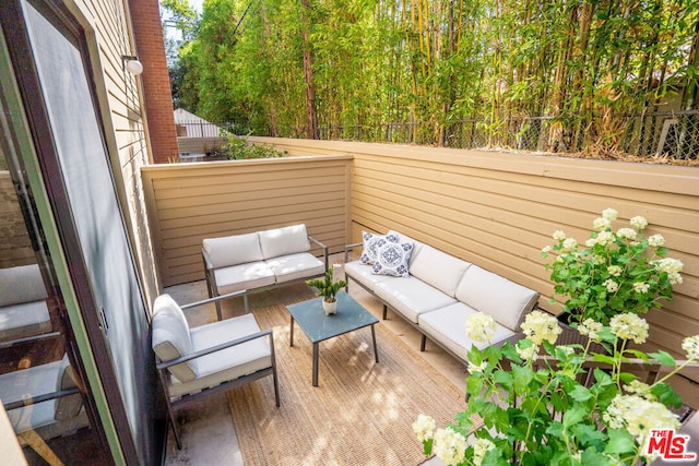 exterior space with a balcony and outdoor lounge area